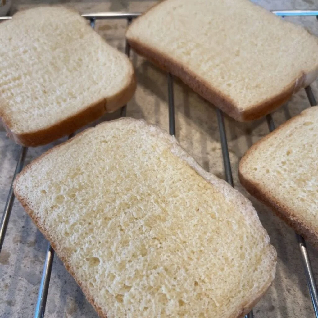cooling and slicing homemade bread